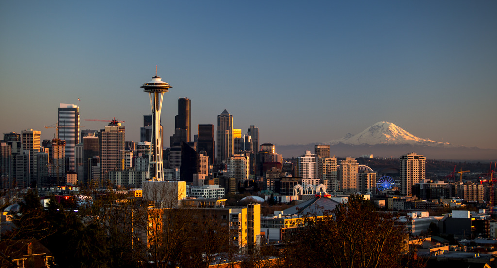 skyline of Seattle, Washington, with Mount Rainier in the background.