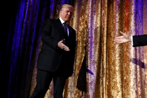 U.S. President-elect Donald Trump takes the stage to speak to diplomats at the Presidential Inaugural Committee (PIC) Chairman's Global Dinner in Washington, U.S. January 17, 2017. REUTERS/Jonathan Ernst - RTSVZN9