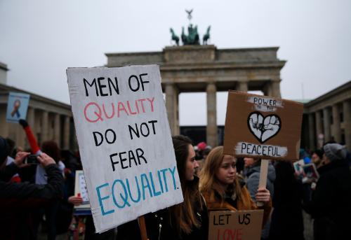 People gather in front of the U.S. Embassy on Pariser Platz beside Brandenburg Gate in solidarity with women's march in Washington and many other marches in several countries, in Berlin, Germany, January 21, 2017. REUTERS/Hannibal Hanschk