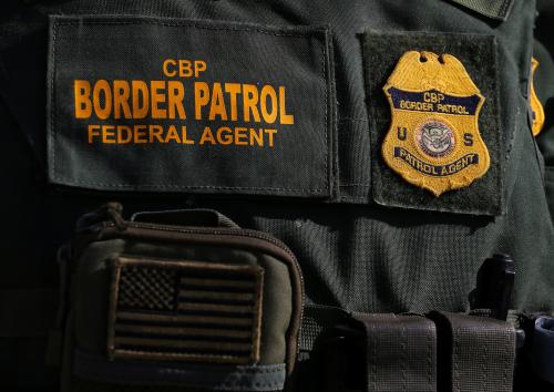 U.S. border patrol agent Alessio Faccin walks along the border fence separating Mexico from the United States near Calexico, California, U.S. February 8, 2017. Picture taken February 8, 2017. REUTERS/Mike Blake - RTX30D1G