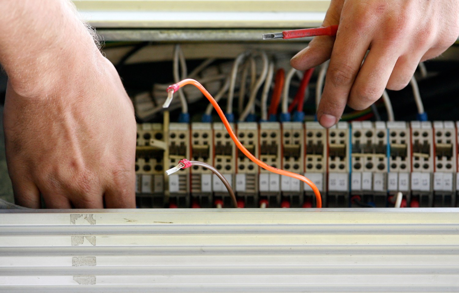 A technician works on network cables