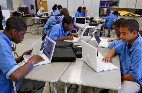 Students at the Lilla G. Frederick Pilot Middle School work on their laptops during a class in Dorchester, Massachusetts June 20, 2008.