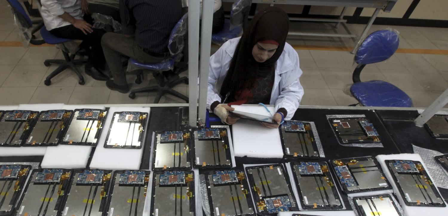 A worker checks Egypt's first tablet computer "Inar" in Benha May 18, 2013. Egypt has produced its very first tablet computer "Inar", part of a national project to distribute the device to students in schools and universities around the country. The Ministry of Military Production in collaboration with the Ministry of Communications presented the scheme last year to Benha Electronics Company known as 'Katron' to manufacture the tablet. Picture taken May 18, 2013. REUTERS/Mohamed Abd El Ghany (EGYPT - Tags: POLITICS SCIENCE TECHNOLOGY BUSINESS EDUCATION) - RTXZZB5