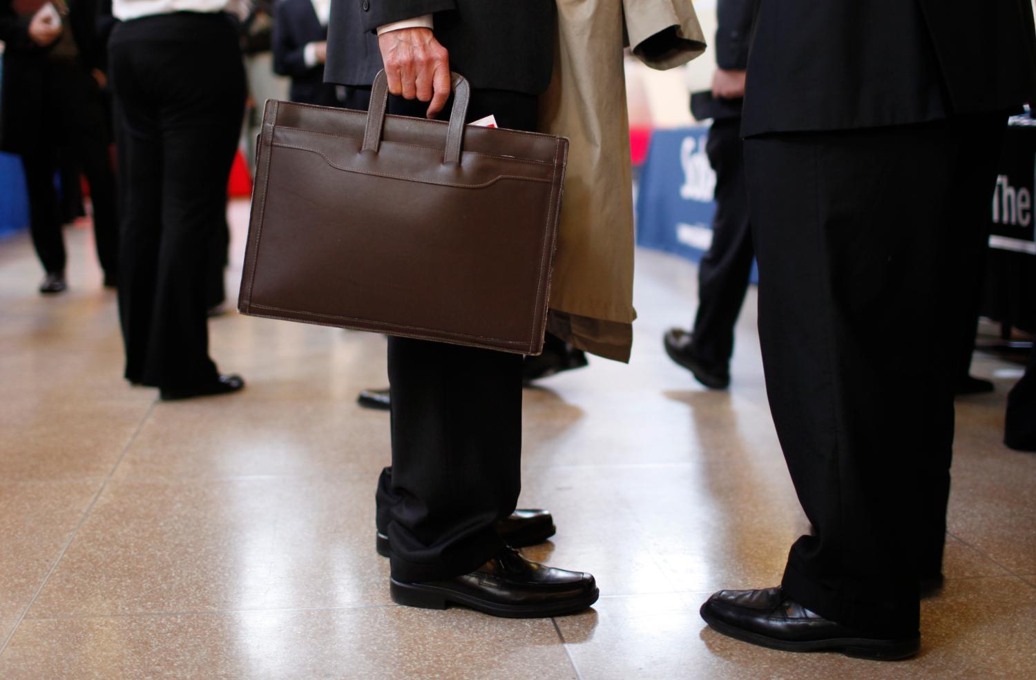 Job seekers attend a large career fair at Rutgers University.