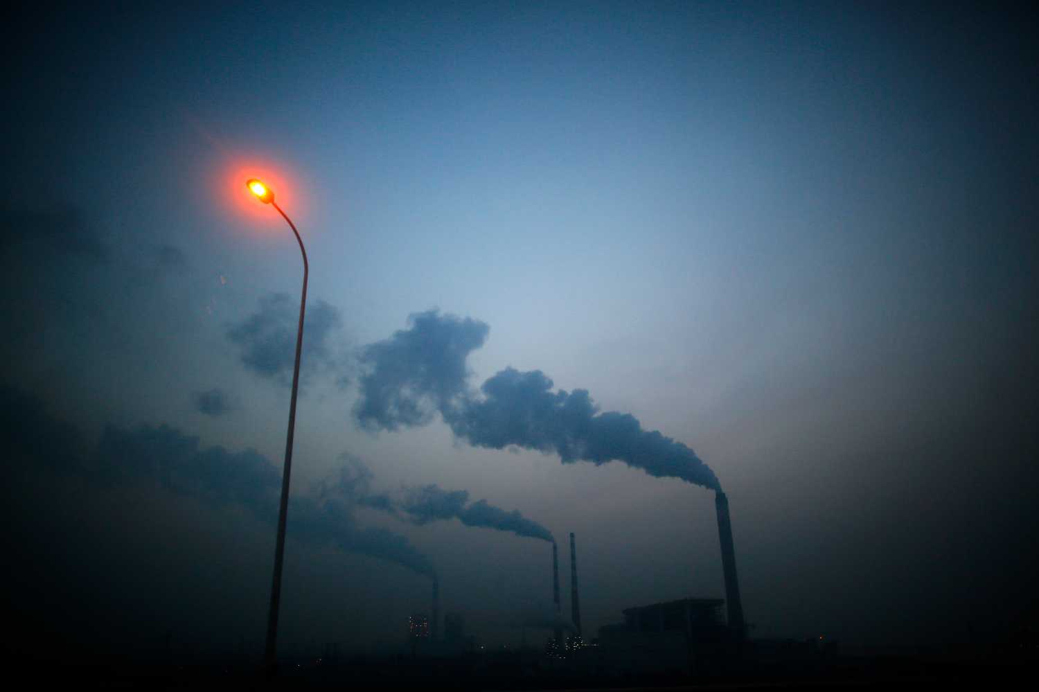 Smoke rises from chimneys