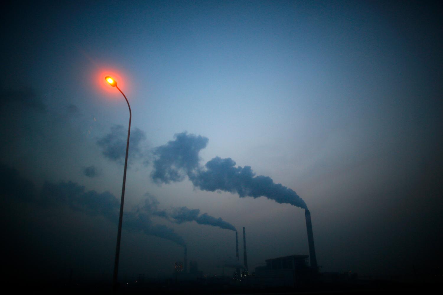 Smoke rises from chimneys