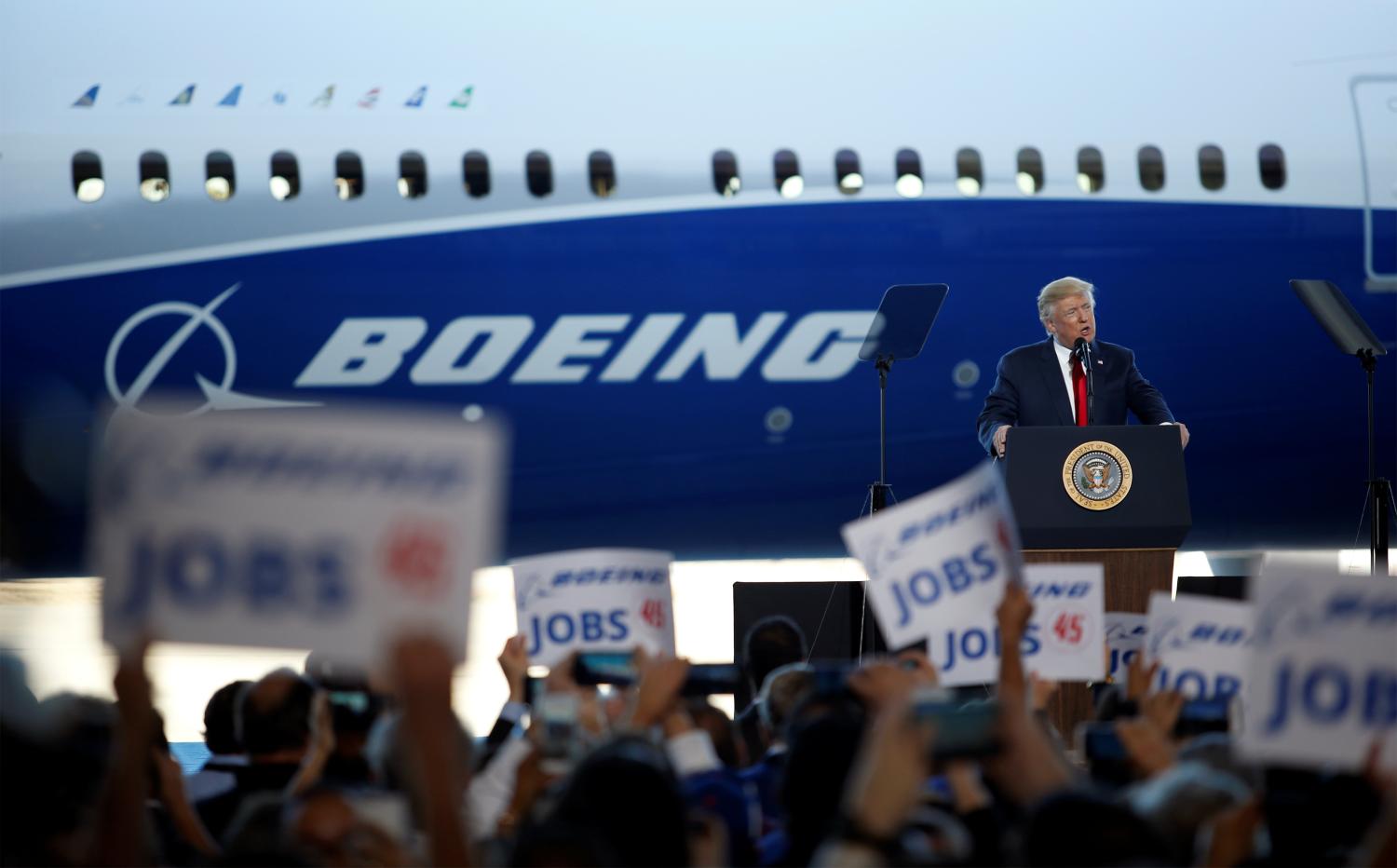 US President Donald Trump speaks to the crowd during a ceremony celebrating the rollout of the Boeing 787-10 Dreamliner at the Boeing South Carolina plant.