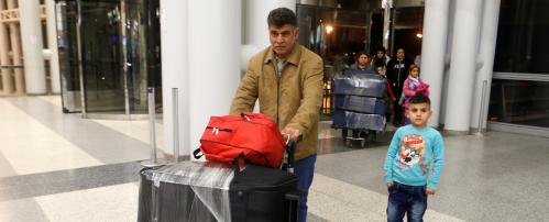 Nizar al-Qassab, an Iraqi Christian refugee from Mosul, pushes his family's luggage at Beirut international airport ahead of their travel to the United States, Lebanon February 8, 2017. REUTERS/Mohamed Azakir - RTX30509