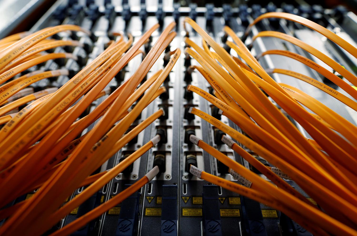Optical fibre cables of Telecom Italia are seen in a telephone exchange in Rome, Italy