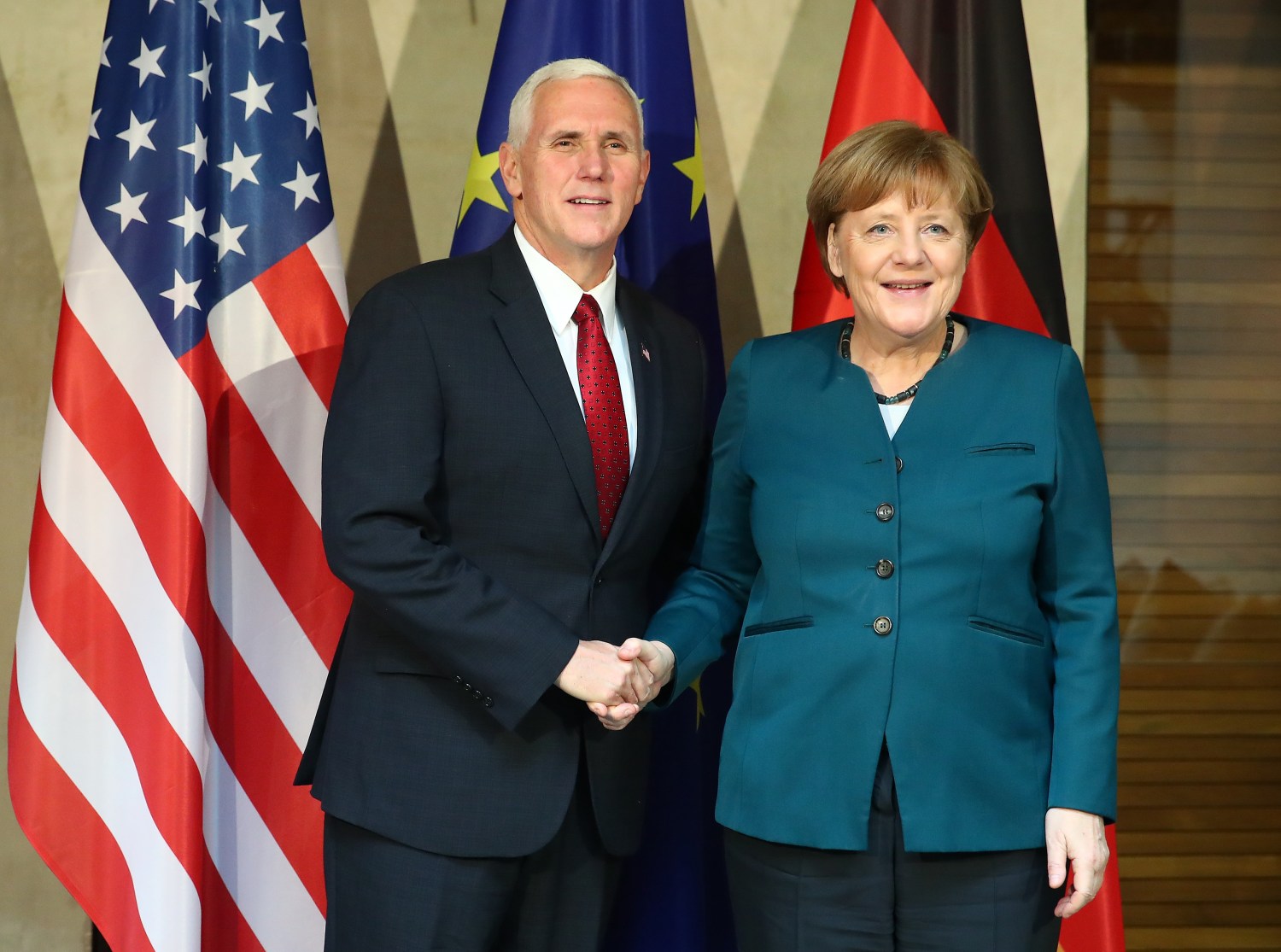 German Chancellor Angela Merkel poses for a picture with U.S. Vice President Mike Pence before their meeting at the 53rd Munich Security Conference in Munich, Germany, February 18, 2017. REUTERS/Michael Dalder - RTSZ8P4