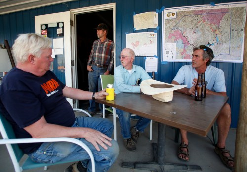 Residents of the rural town of Prairie visit after a meeting with fire-fighting officials to talk about the Elk Complex and Pony Complex wildfires burning outside Boise