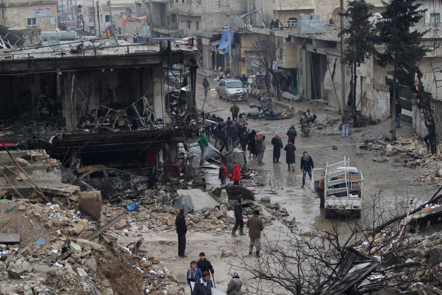 People inspect damage after a fuel truck exploded yesterday in the centre of rebel-held Azaz, near Syria's border with Turkey January 8, 2017. REUTERS/Khalil Ashawi