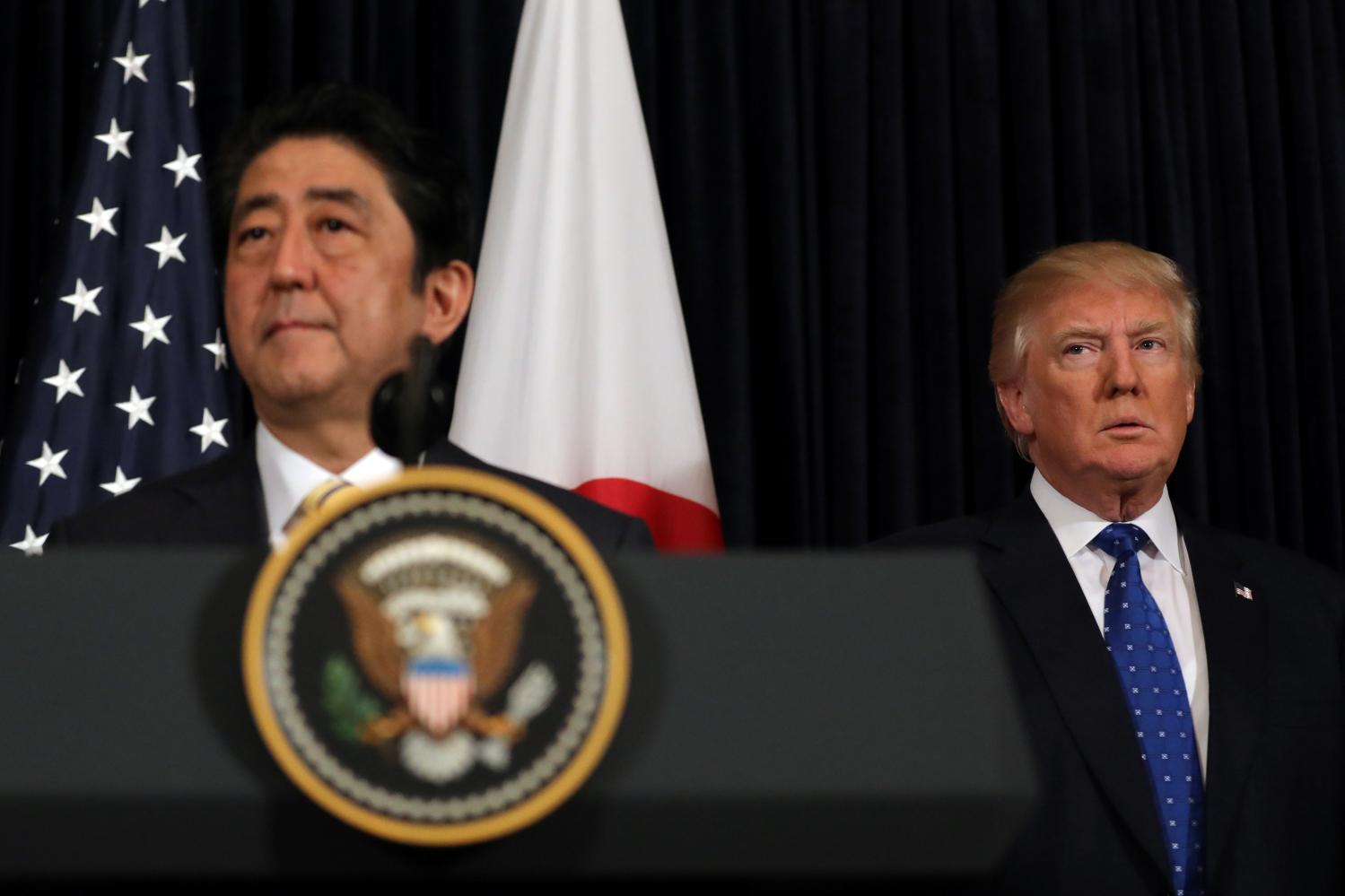 President Trump and PM Abe standing together