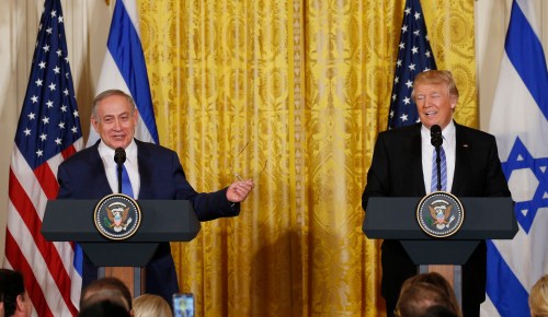 U.S. President Donald Trump (R) laughs with Israeli Prime Minister Benjamin Netanyahu at a joint news conference at the White House in Washington, U.S., February 15, 2017. REUTERS/Kevin Lamarque - RTSYUD8