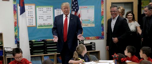 Republican presidential nominee Donald Trump visits children in a classroom during a campaign visit to the International Church of Las Vegas and the International Christian Academy in Las Vegas
