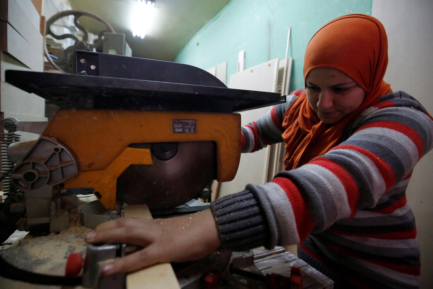 Asmaa Megahed, 30 years old, who's known as "Ousta Asmaa", a carpenter and designer, works inside her workshop in Cairo, Egypt February 27, 2017. Picture taken February 27, 2017. Ousta Asmaa, who started working in this profession by helping her husband in his workshop sends a message to women "That they shouldn't pay attention to those who comment negatively on the work traditionally for men, forget them. Women can do any business no matter how difficult. Do anything you love, do not give up for anyone who wants to discourage you, there are many men saying that women cant do anything just "cooking and cooking", but women can do the impossible". REUTERS/Amr Abdallah Dalsh - RTS11Z8L