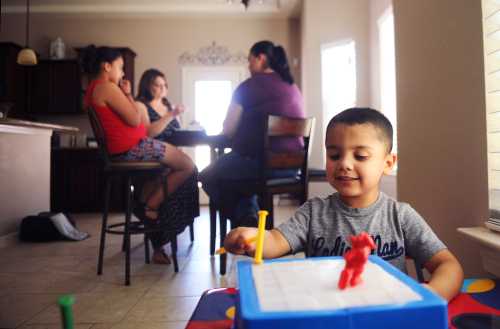 Kane plays with a toy at the home of his family in El Paso