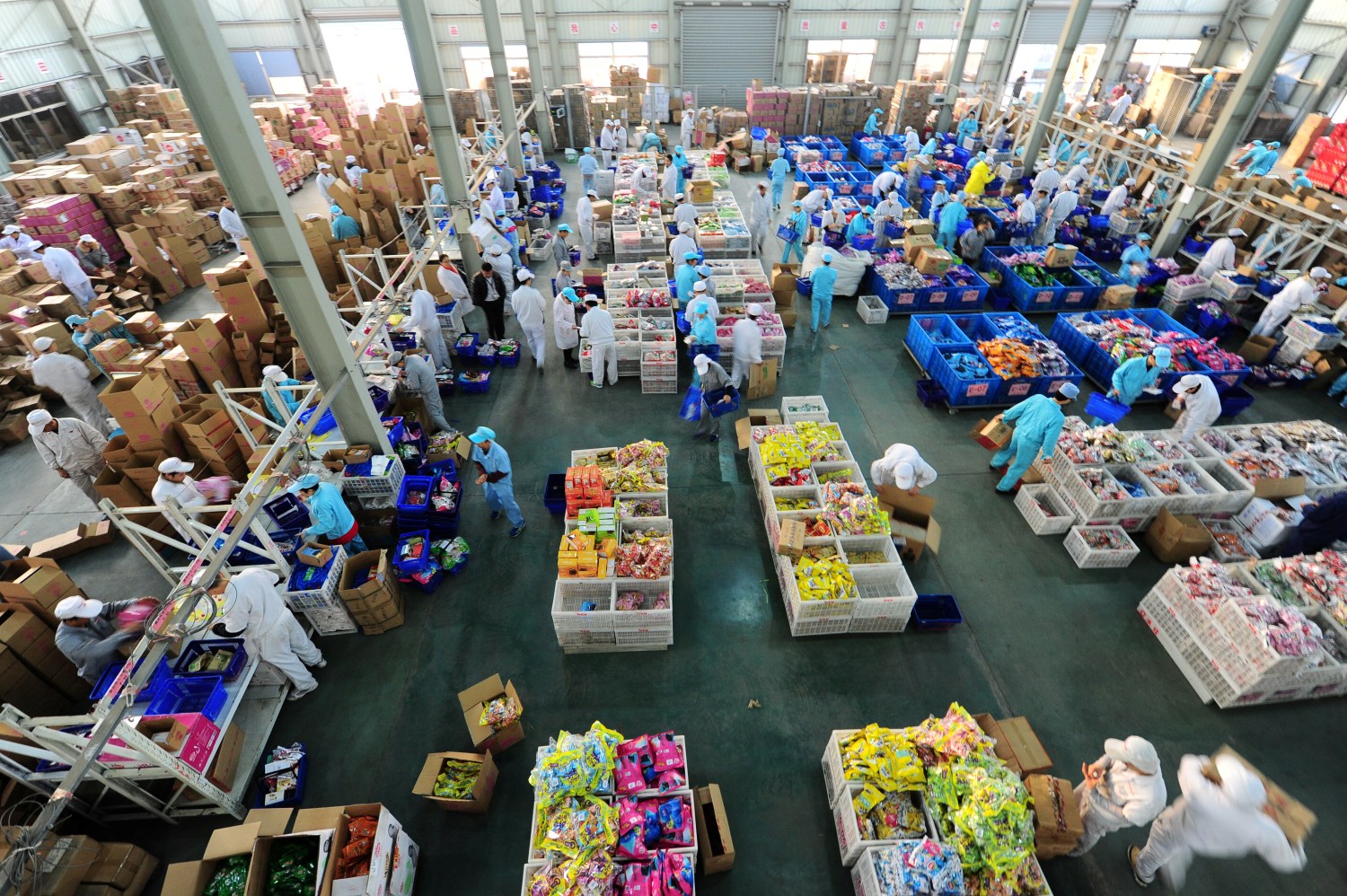 Employees work extra hours to pack products at a factory during the 11.11 shopping festival, in Taicang, Jiangsu province.