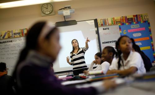 Teacher Jaclyn Kruljac speaks to her students in 5th grade class at Walsh Elementary School in Chicago, Illinois, March 1, 2013. According to officials in U.S. President Barack Obama's administration, possible consequences of impending across-the-board U.S. government budget cuts, Illinois will lose approximately $33.4 million in education, putting around 460 teacher and aide jobs at risk that would receive funding. REUTERS/Jim Young