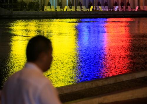 Photo: The colors of the Colombian flag are reflected in a canal next to the convention center in Cartagena, Colombia. [Reuters/Jaime Saldarriaga]