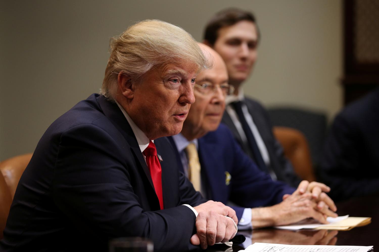 U.S. President Donald Trump, Wilbur Ross, Trump's pick for Commerce Secretary (C) and Senior advisor and Trump's son-in-law Jared Kushner attends a meeting with congressional leaders to discuss trade deals at the at the Roosevelt room of the White House in Washington U.S., February 2, 2017. REUTERS/Carlos Barria - RTX2ZDJK