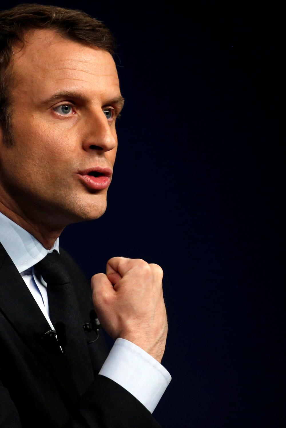 Emmanuel Macron, head of the political movement En Marche !, or Onwards !, and candidate for the 2017 presidential election, attends a meeting in Reims, France March 17, 2017. REUTERS/Pascal Rossignol - RTX31JI4