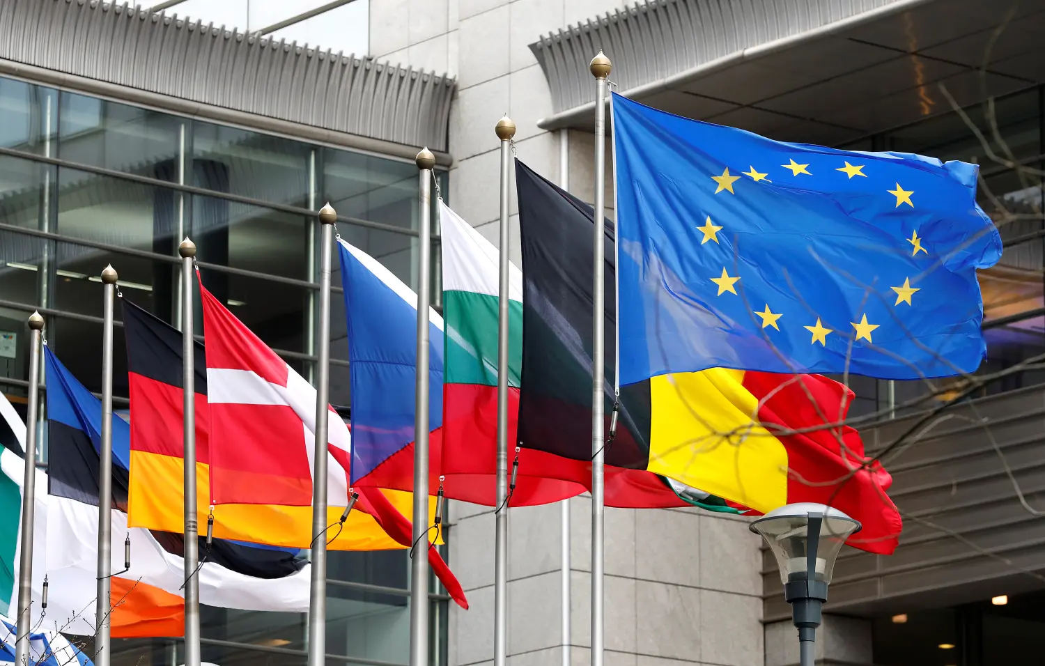 European and national flags fly outside the European Parliament while European Commission President Jean-Claude Juncker presents a white paper on options for shoring up unity once Britain launches its withdrawal process, in Brussels, Belgium, March 1, 2017. REUTERS/Yves Herman - RTS10Z4B