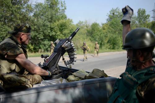 Members of Ukrainian self-defence battalion "Donbass" are seen at their positions near the town of Pervomaysk July 31, 2014. Ukraine said on Thursday it had suspended offensive operations in its military campaign in east Ukraine to help international experts reach the downed Malaysian airliner's crash site but separatists were continuing to attack its positions. REUTERS/Maks Levin (UKRAINE - Tags: POLITICS CIVIL UNREST MILITARY) - RTR40TXH
