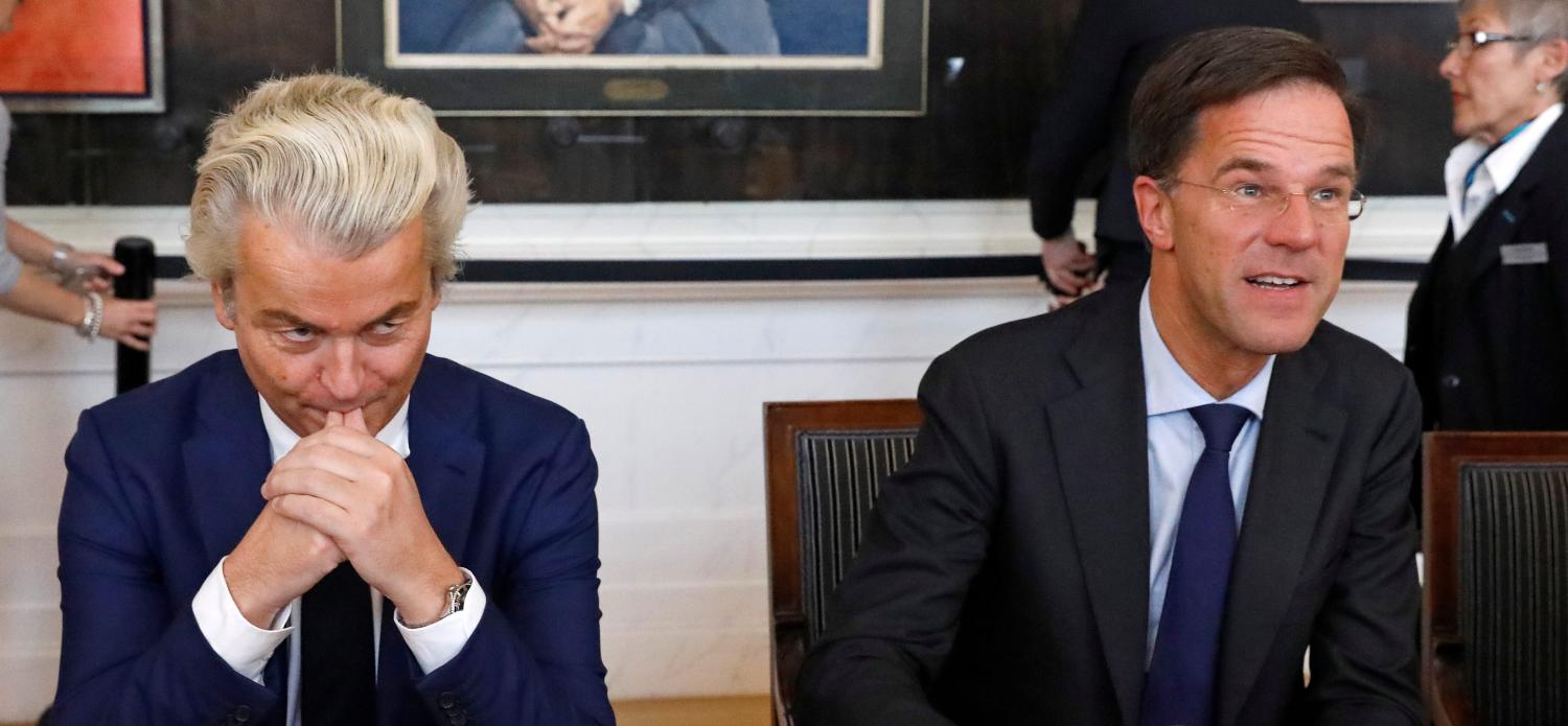 Dutch Prime Minister Mark Rutte (R) of the VVD Liberal party and Dutch far-right politician Geert Wilders of the PVV Party take part in a meeting at the Dutch Parliament after the general election in The Hague, Netherlands, March 16, 2017. REUTERS/Yves Herman TPX IMAGES OF THE DAY - RTX31B1J