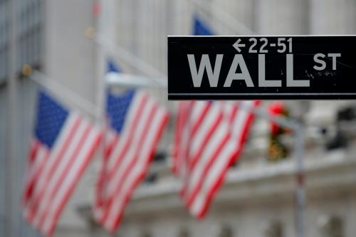 A street sign for Wall Street is seen outside the New York Stock Exchange (NYSE) in Manhattan, New York City, U.S. December 28, 2016. REUTERS/Andrew Kelly - RTX2WRNR