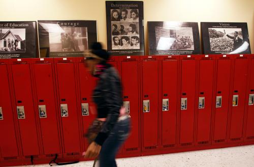 A student at Walter H. Dyett High School walks through the hallway in Chicago, Illinois, in this photo taken on October 5, 2012. The bipartisan education reform movement sweeping the nation calls for rating schools by their students' test scores and then taking drastic steps to overhaul the worst performers by firing the teachers, turning the schools over to private management or shutting them down altogether. But in communities across the United States, anger at school closures is rising. REUTERS/Jim Young
