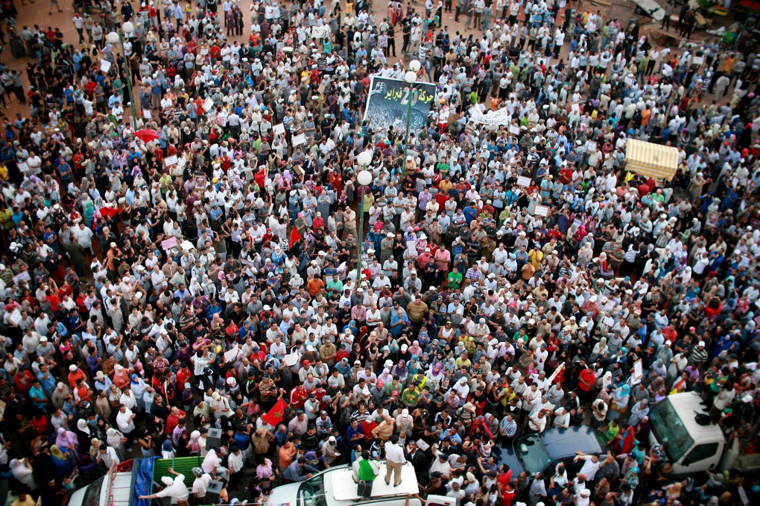 Protesters take part in a rally organised by the February 20 opposition movement in Casablanca July 10, 2011. Thousands of Moroccans staged protests on Sunday, the latest in a series of peaceful demonstrations by a youth-led movement to demand reforms that go beyond constitutional changes crafted by the palace. REUTERS/Macao (MOROCCO - Tags: POLITICS CIVIL UNREST IMAGES OF THE DAY) - RTR2OQDL