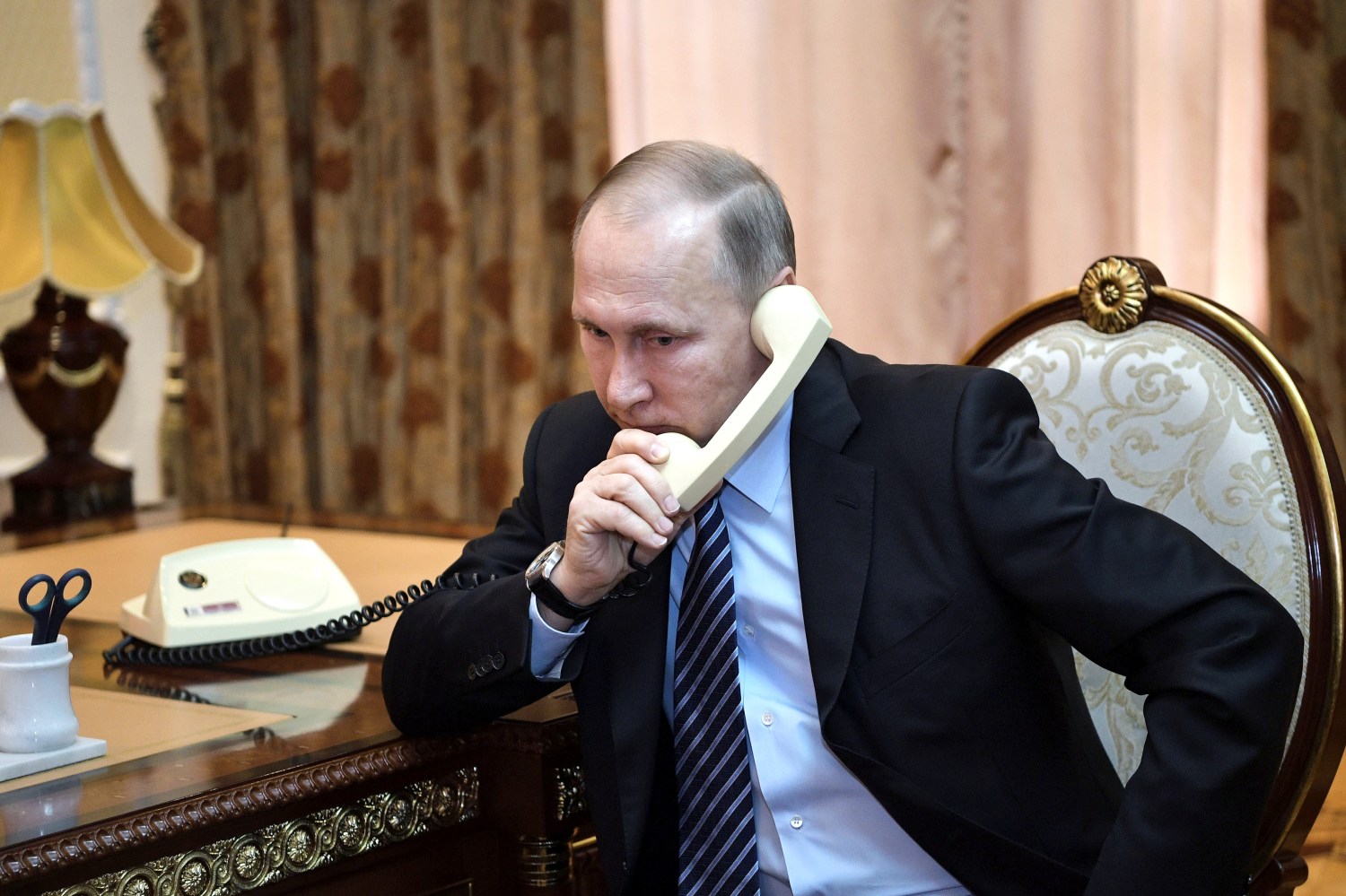 Russia's President Vladimir Putin speaks by phone, February 28, 2017. Sputnik/Alexei Nikolsky/Kremlin via REUTERS ATTENTION EDITORS - THIS IMAGE WAS PROVIDED BY A THIRD PARTY. EDITORIAL USE ONLY. THIS IMAGE HAS BEEN SUPPLIED BY A THIRD PARTY. IT IS DISTRIBUTED, EXACTLY AS RECEIVED BY REUTERS, AS A SERVICE TO CLIENTS - RTS10QE5