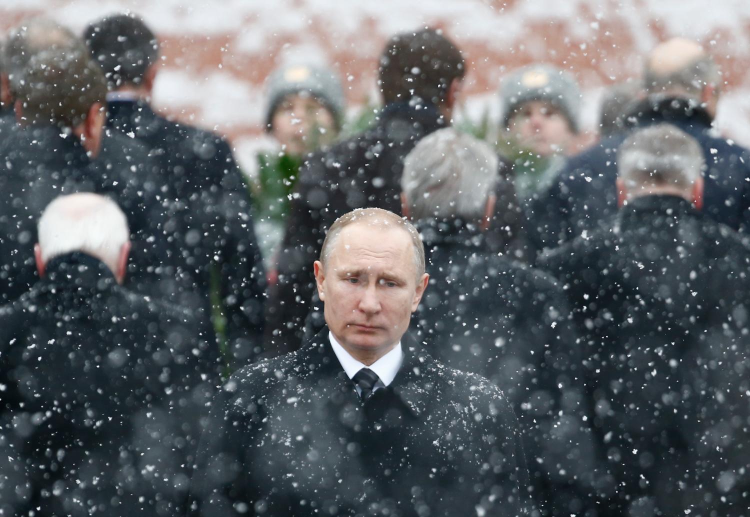 Russian President Putin attends wreath laying ceremony to mark Defender of Fatherland Day at Tomb of Unknown Soldier by Kremlin wall in Moscow