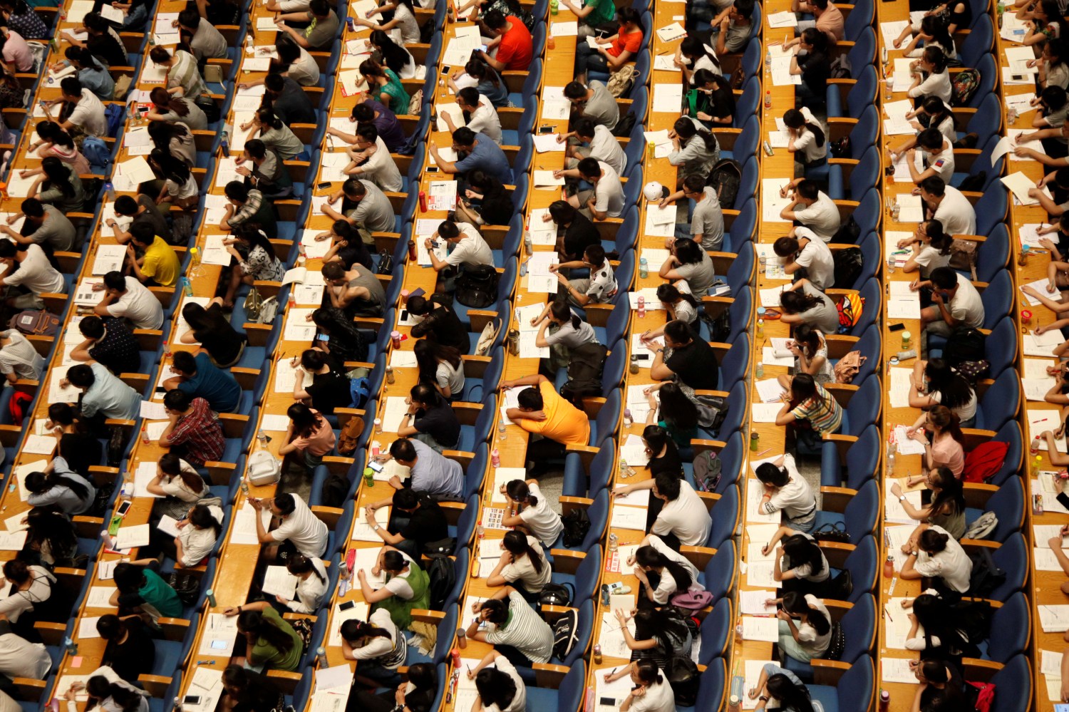Students attend a lecture for the entrance exam for postgraduate studies at a hall in Jinan, Shandong