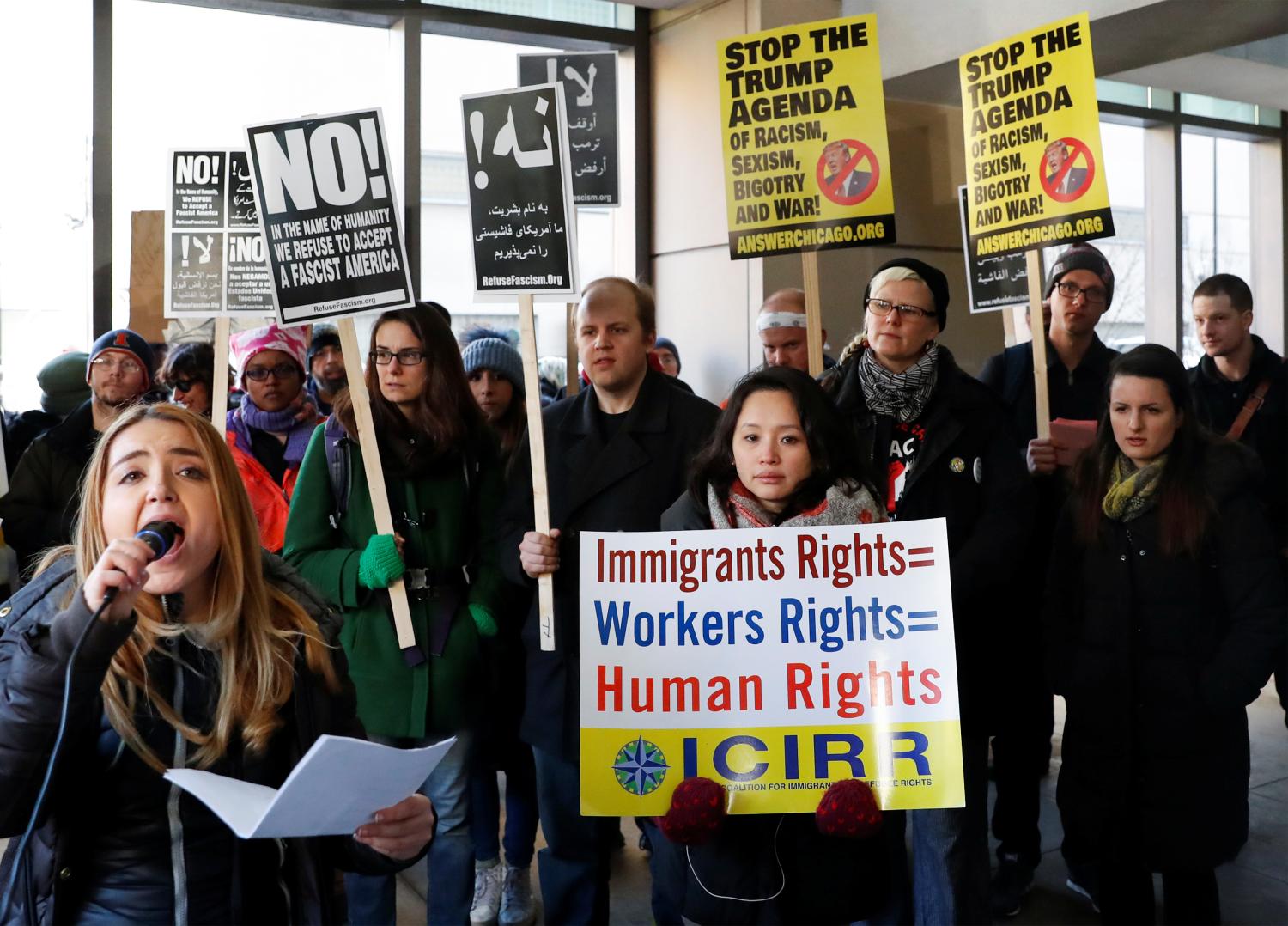 Demonstrators protest against President Donald Trump's revised travel ban outside the offices of the U.S. Immigration and Customs Enforcement in Chicago, Illinois