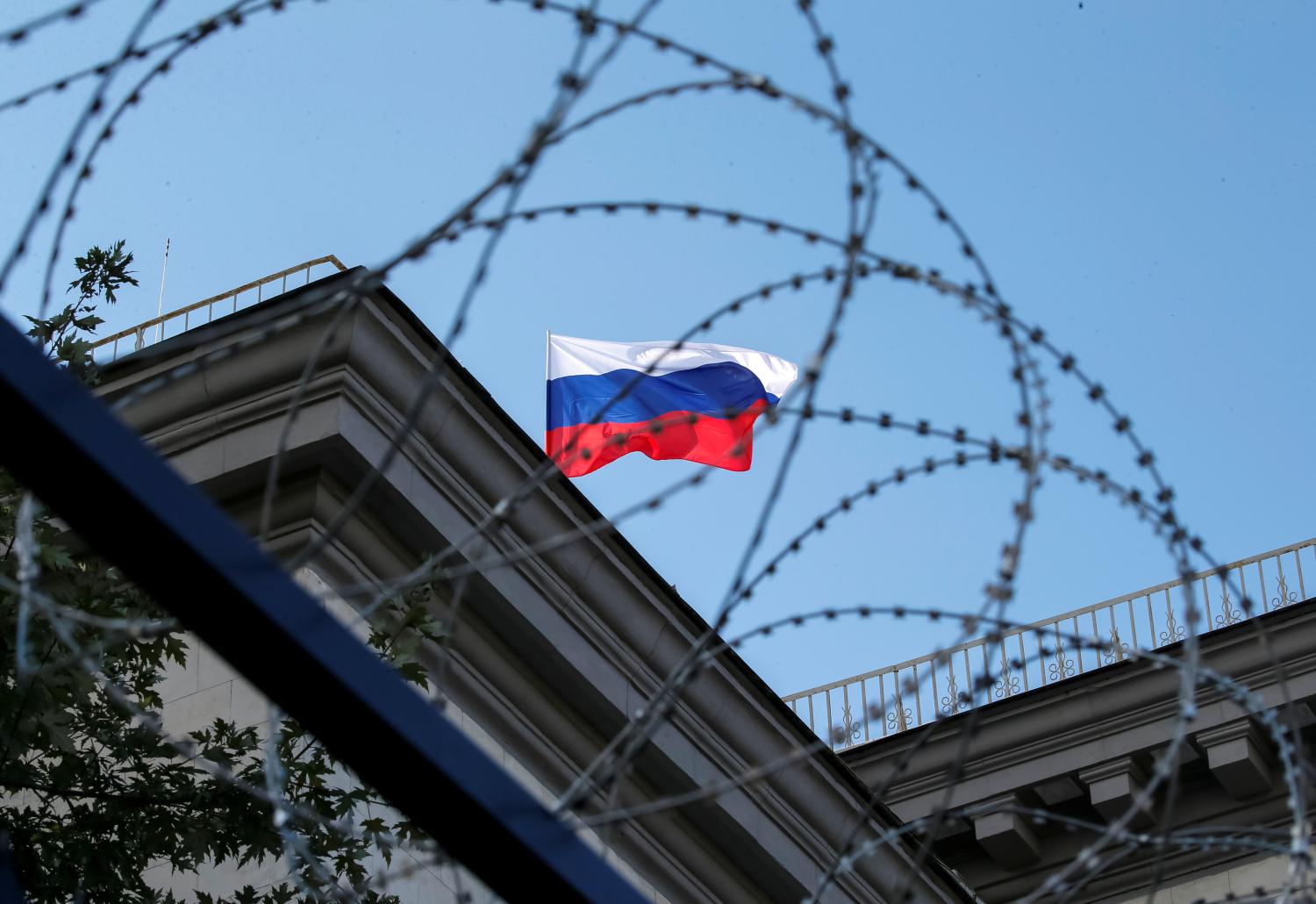 A Russian national flag is seen at the roof of the Russian embassy in Kiev, Ukraine, September 18, 2016. REUTERS/Gleb Garanich - RTSO9OJ
