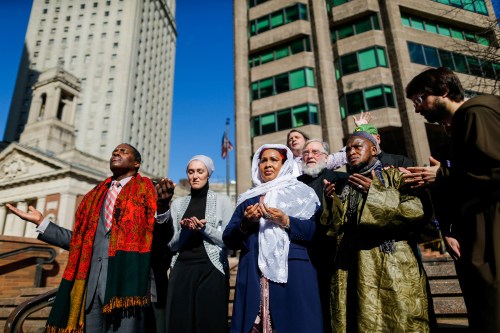 Hawa Bah, (C) mother of Mohamed Bah and people take part in a prayer at one Saint Andrews Plaza in Lower Manhattan, New York, U.S. February 24, 2017. Muslim Leaders lead a prayer action demanding response from US Attorney Preet Bharara and call for investigation and prosecution in NYPD killing of Mohamed Bah. REUTERS/Eduardo Munoz - RTS107BH