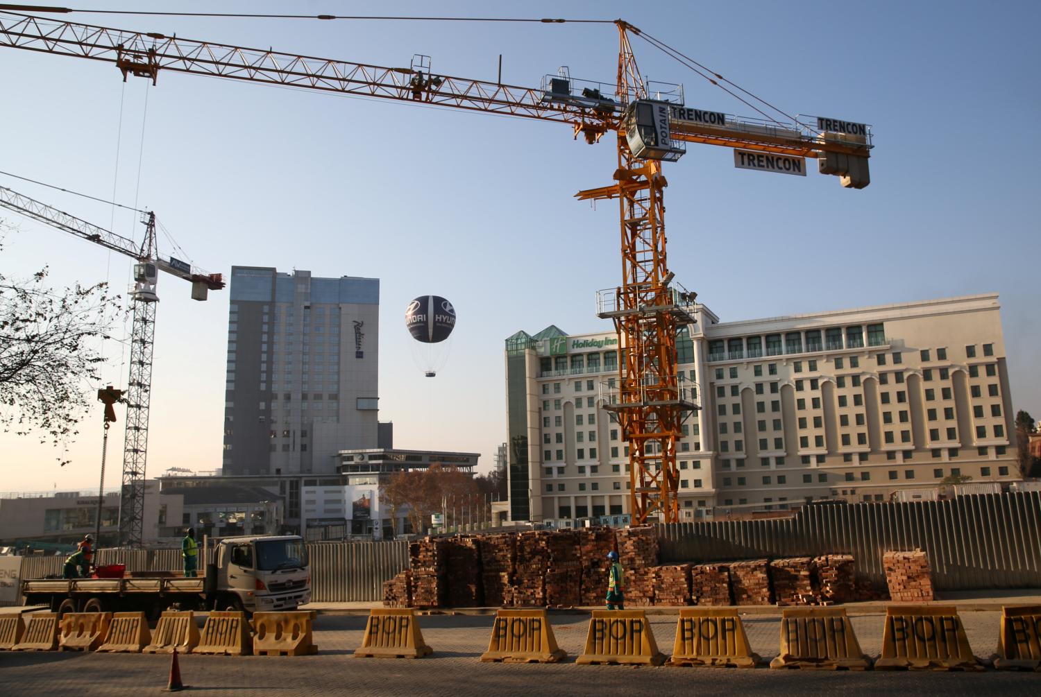 Cranes are seen at a construction site in Sandton outside Johannesburg