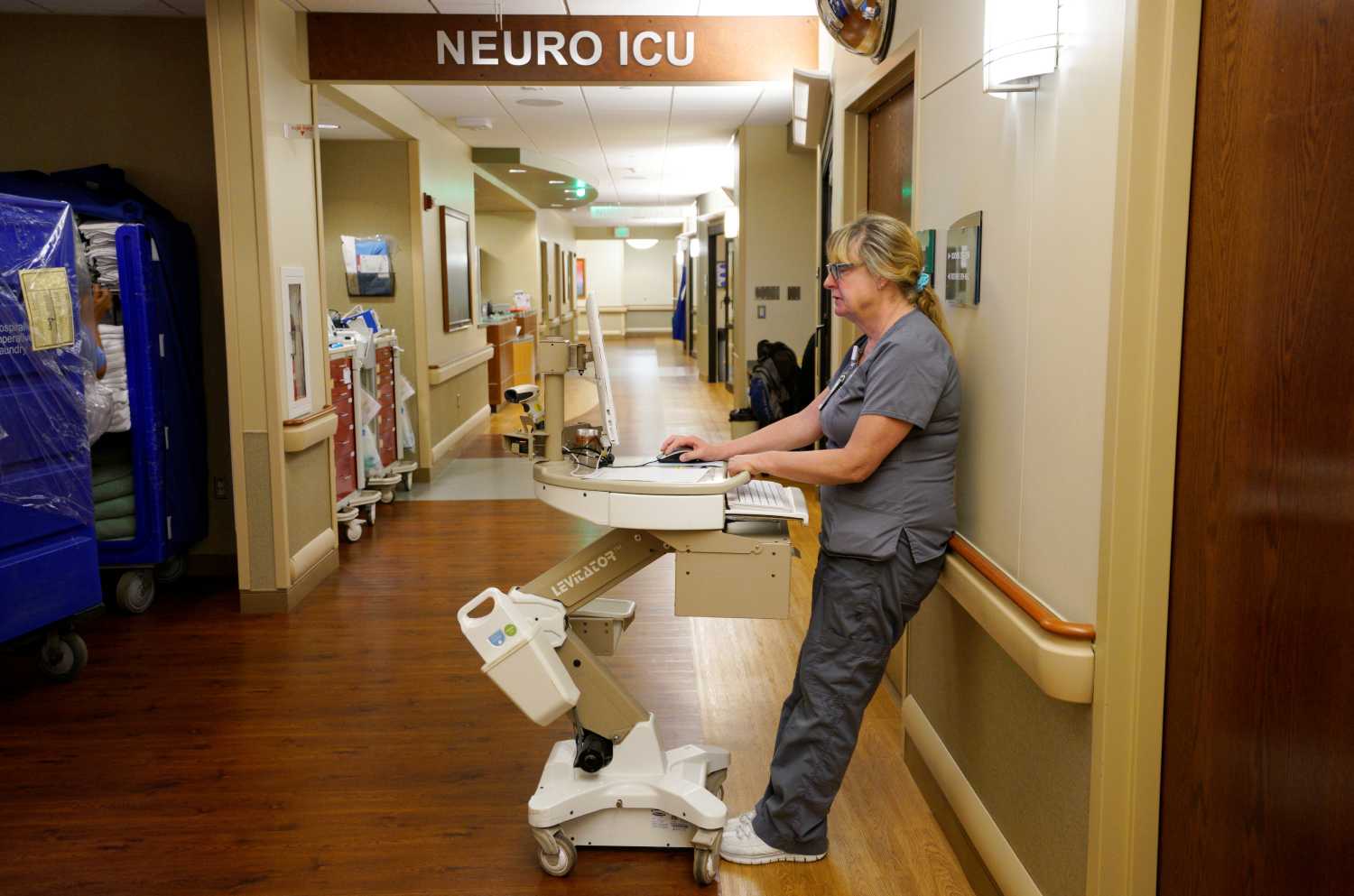 Registered Respiratory Therapist Joni Wegeman does some charting in the hall at Littleton Adventist Hospital, part of Centura Health in Littleton