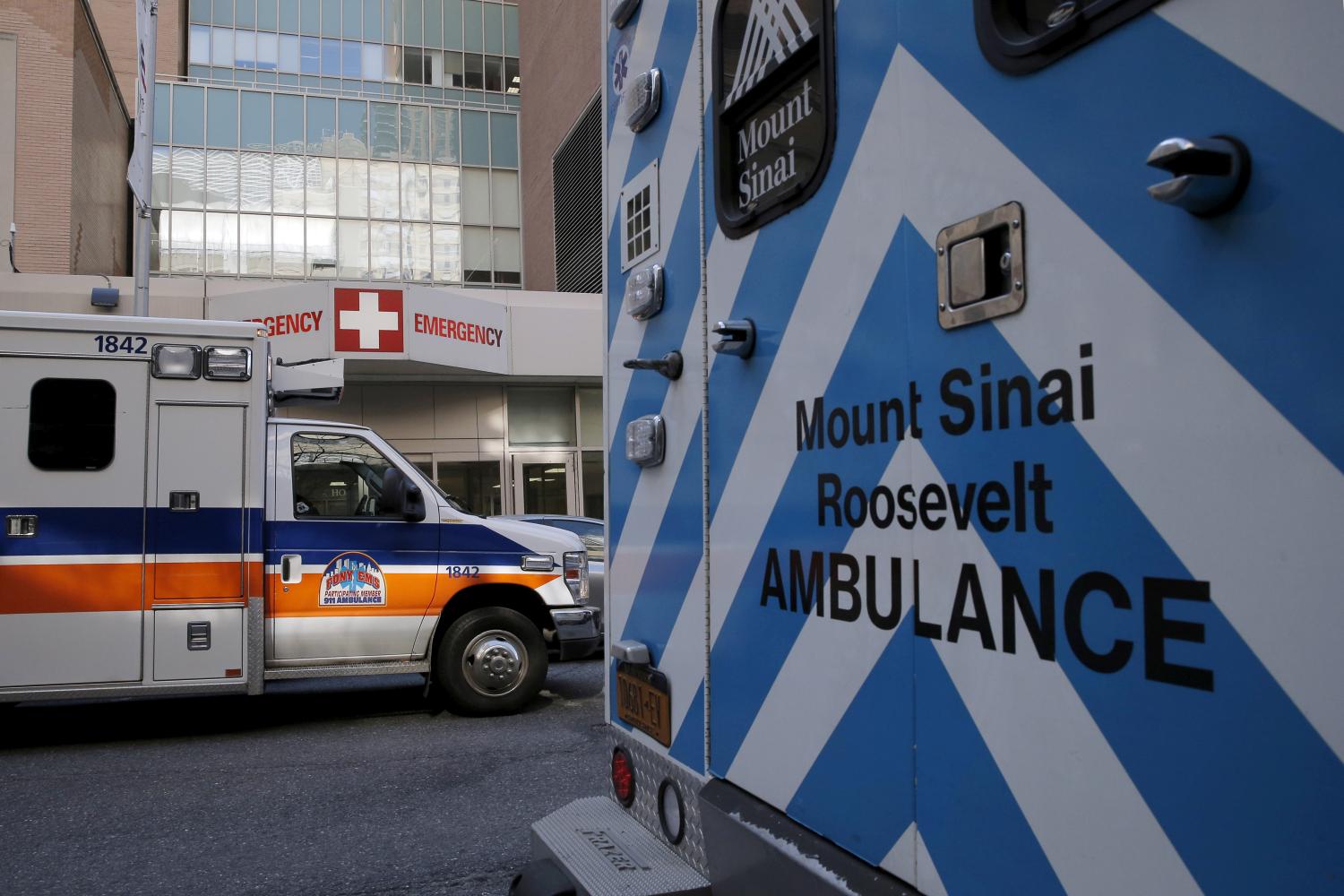 Ambulances are parked outside the emergency room entrance at Mount Sinai West Roosevelt Hospital in New York
