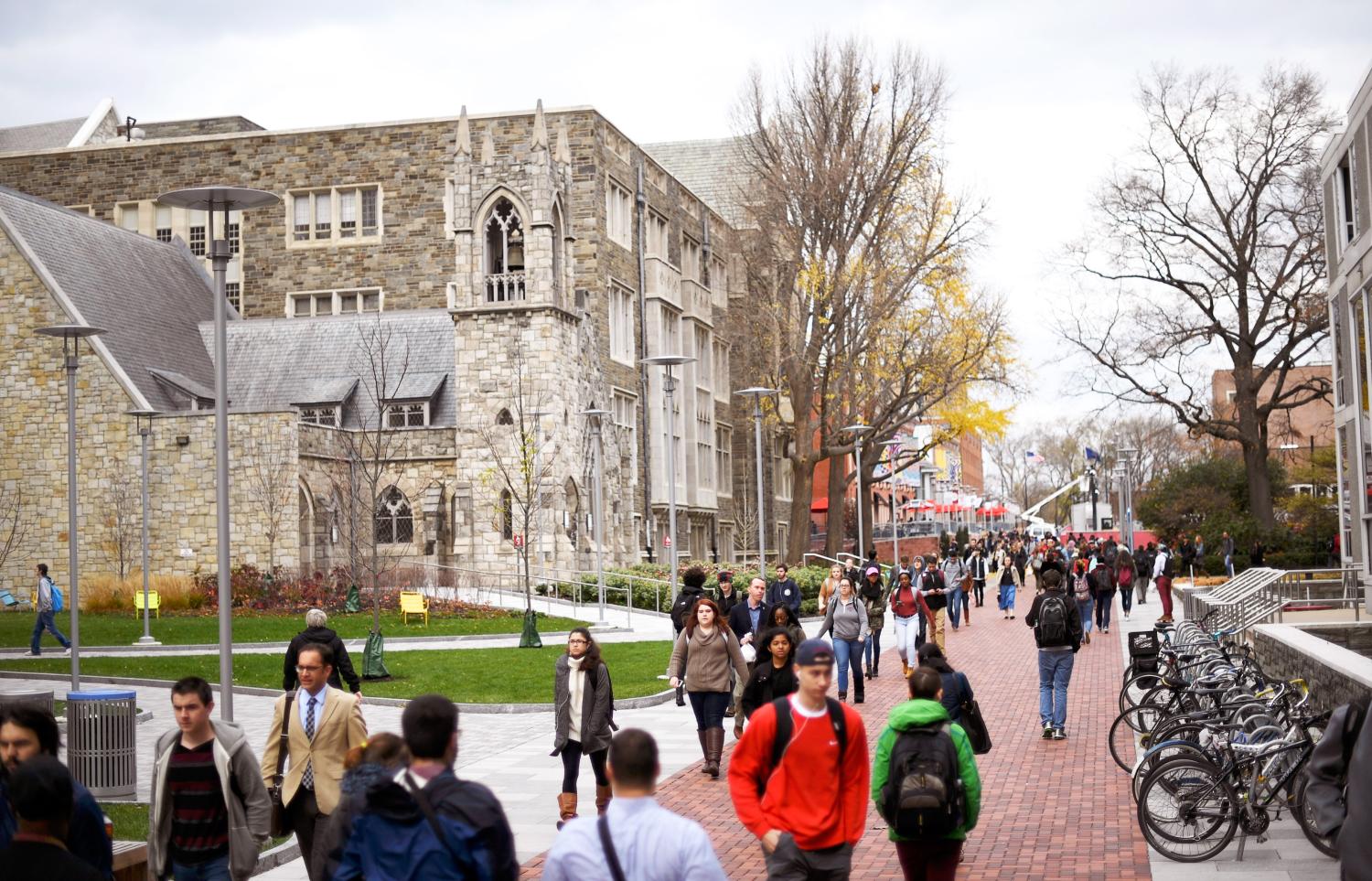 Students walk through the campus of Temple University, which has an enrollment of more than a 38,000 and offers 464 academic degree programs, in Philadelphia, Pennsylvania, U.S.