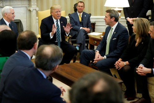 U.S. President Donald Trump, Vice President Mike Pence and Office of Management and Budget (OMB) Director Mick Mulvaney meet with U.S. Representative Mark Walker (R-NC) and members of the Republican Study Committee at the White House in Washington, U.S. March 17, 2017. REUTERS/Jonathan Ernst