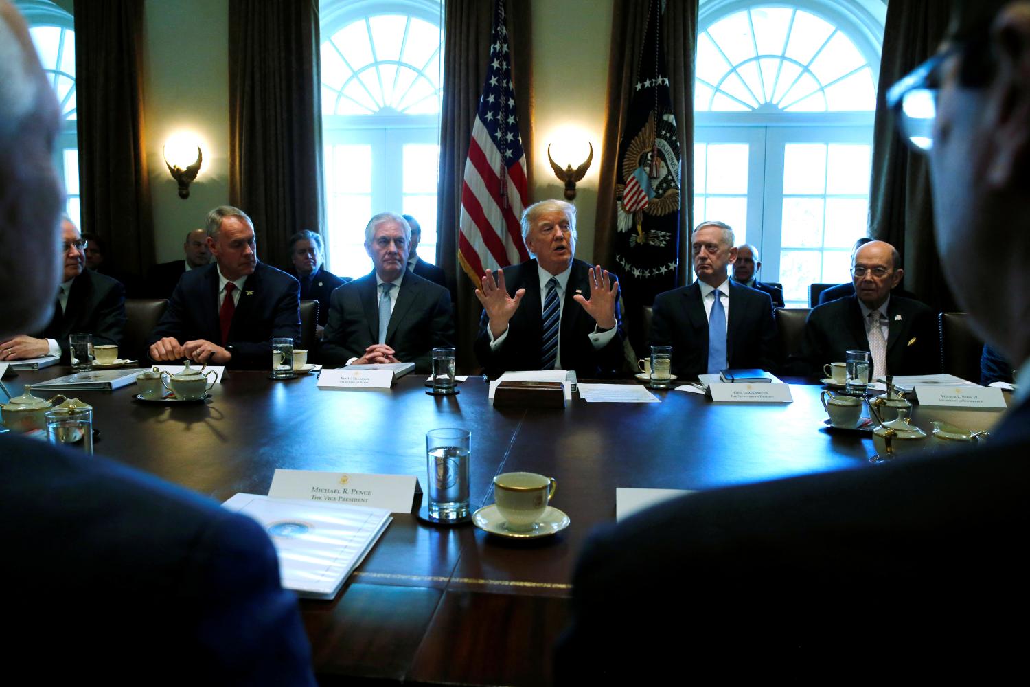 U.S. President Donald Trump (C), flanked by Interior Secretary Ryan Zinke (from L), Secretary of State Rex Tillerson, Defense Secretary James Mattis and Commerce Secretary Wilbur Ross, holds a cabinet meeting at the White House in Washington, U.S. March 13, 2017. REUTERS/Jonathan Ernst - RTX30UWZ