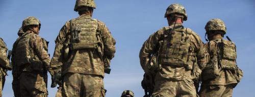 U.S. soldiers from Dragon Troop of the 3rd Cavalry Regiment discuss their mission during their first training exercise of the new year near operating base Gamberi in the Laghman province of Afghanistan January 1, 2015. REUTERS/Lucas Jackson (AFGHANISTAN - Tags: CIVIL UNREST POLITICS MILITARY) - RTR4JTM5