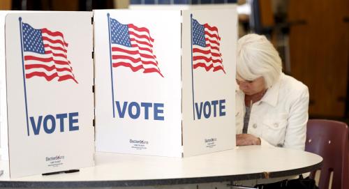 A voter fills out her ballot to vote in the Super Tuesday election at Sleepy Hollow Elementary School in Falls Church, Virginia