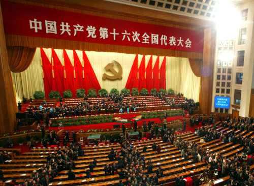 Delegates leaves the Great Hall of the People after the closing of closing the 16th Chinese Communist Party Congress in Beijing November 14, 2002. China confirmed on Thursday that President Jiang is retiring as Communist Party Chief and that he and top colleagues will hand over to a new generation of leaders under Vice President Hu Jintao. REUTERS/Guang Niu ASW/PB - RTRDTKT