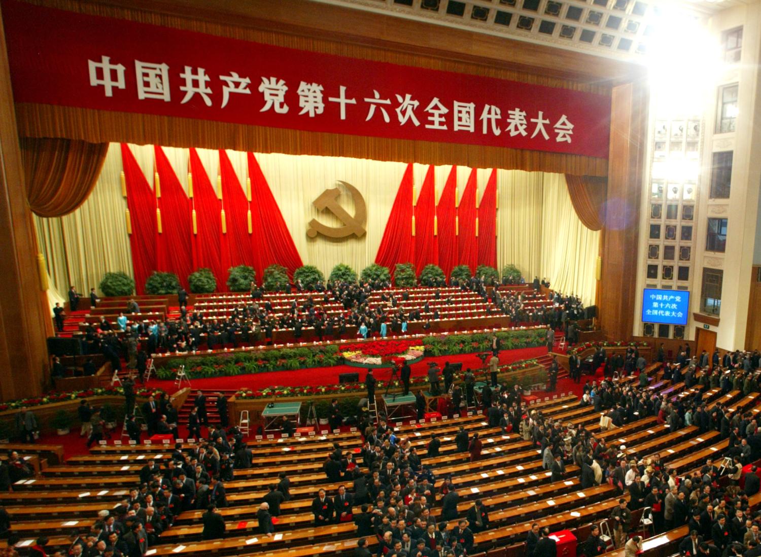 Delegates leaves the Great Hall of the People after the closing of closing the 16th Chinese Communist Party Congress in Beijing November 14, 2002. China confirmed on Thursday that President Jiang is retiring as Communist Party Chief and that he and top colleagues will hand over to a new generation of leaders under Vice President Hu Jintao. REUTERS/Guang Niu ASW/PB - RTRDTKT