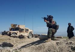 DATE IMPORTED:April 14, 2017A member of AfghanistanÕs special forces point his gun as he observes the enemy lines in Achin district of Nangarhar province, in eastern Afghanistan April 14, 2017. REUTERS/Parwiz