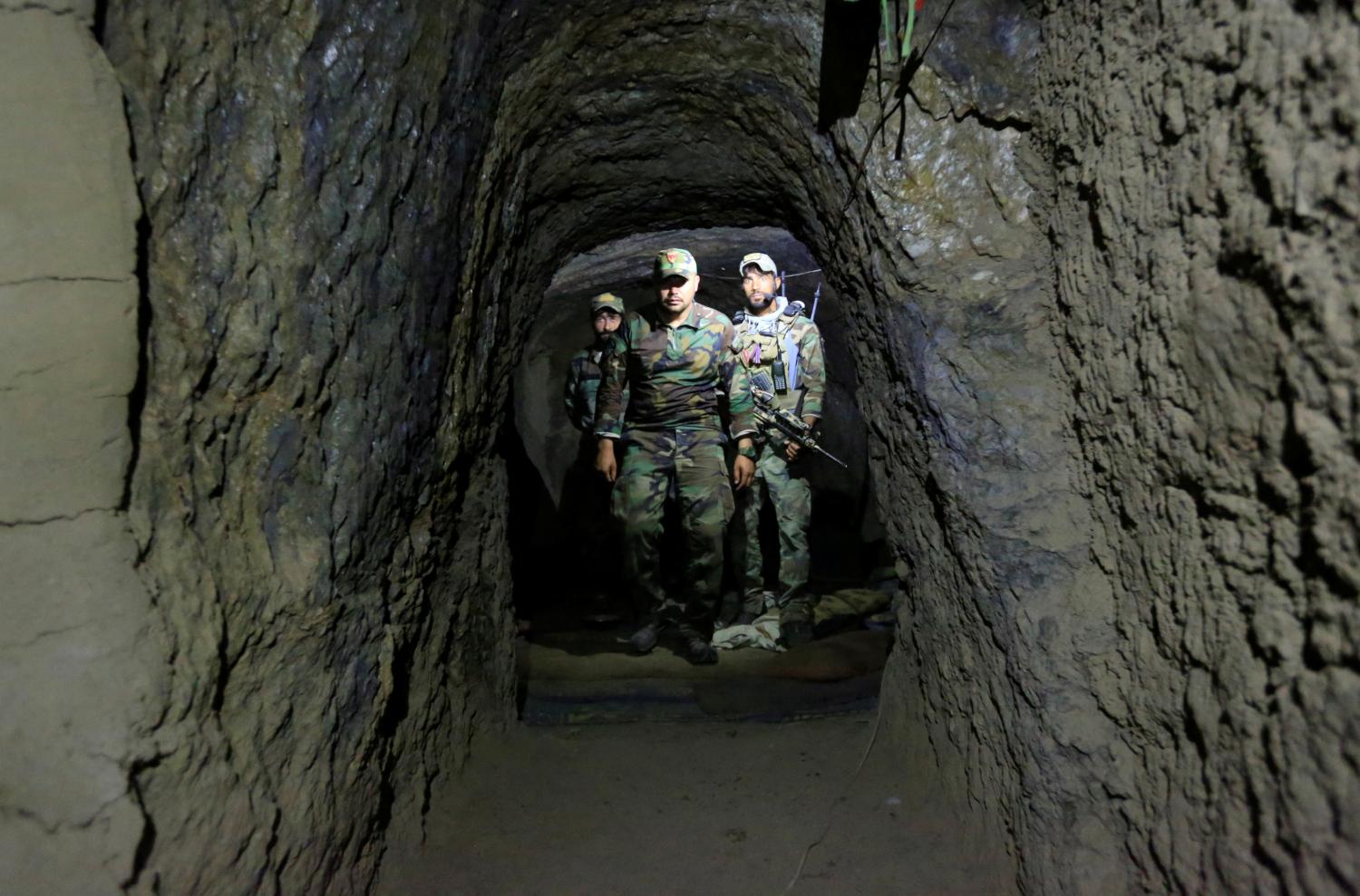 DATE IMPORTED:April 24, 2017Afghan Special Forces inspect inside a cave which was used by suspected Islamic State militants at the site where a MOAB, or ''mother of all bombs'', struck the Achin district of the eastern province of Nangarhar, Afghanistan April 23, 2017. REUTERS/Parwiz